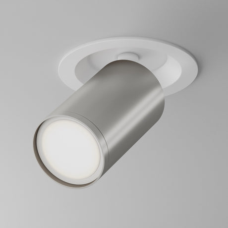 The Focus S Single Recessed Spotlight in white and silver is a modern cylindrical ceiling fixture with metallic finish, mounted on a light grey surface. It features a 360° swivel for versatile downward illumination.