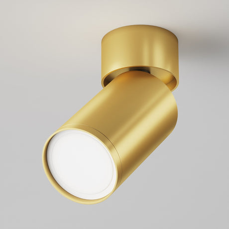 The Focus S Single Surface-Mounted Spotlight in matte gold features a modern cylindrical design against a light gray background, perfect for contemporary interiors. It boasts a sleek, minimalist look with a smooth finish and adjustable lighting angled slightly downward.