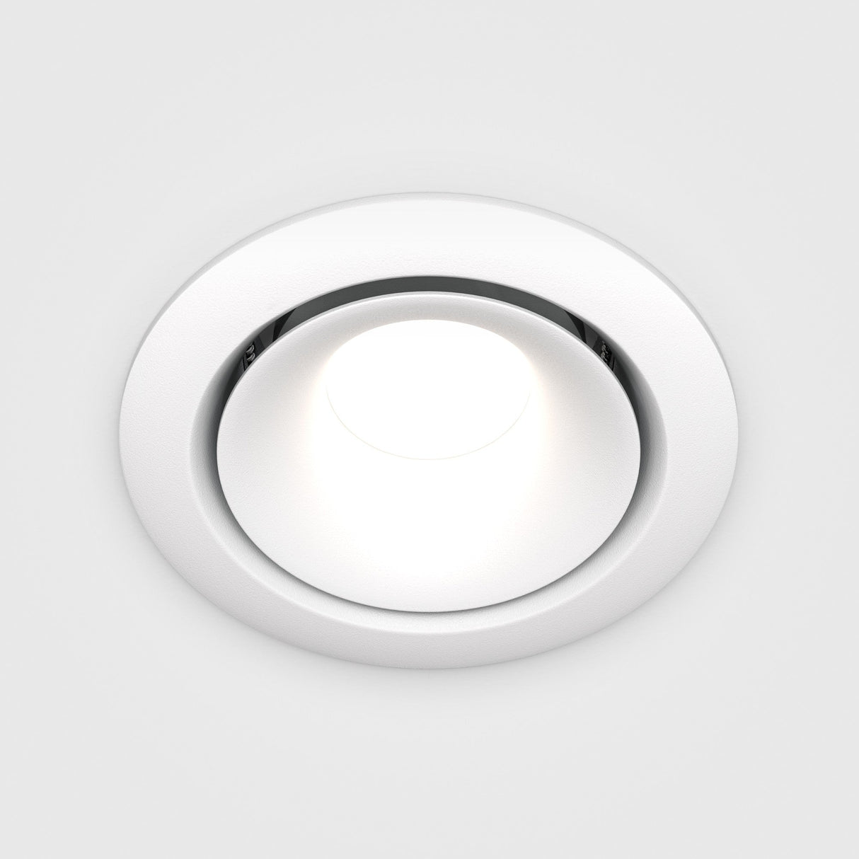 The Yin Round Recessed Downlight, a white circular LED with dimming, is illuminated against a plain white backdrop.