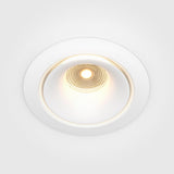 The Yin LED Dimmable Round Recessed Downlight offers a central illumination, white trim, and a soft 3000K glow.