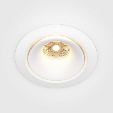 The Yin LED Dimmable Round Recessed Downlight offers a central illumination, white trim, and a soft 3000K glow.
