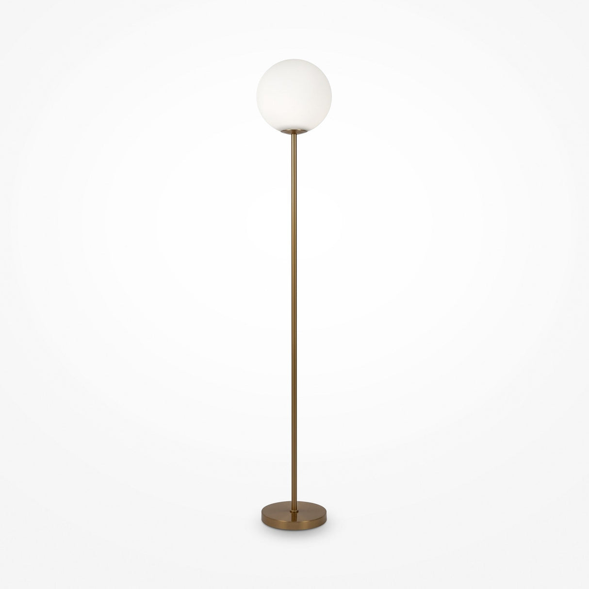 The Ring Floor Lamp in brass showcases a frosted glass globe shade, standing elegantly on a circular base against a plain white background, making it a chic modern addition to any space.