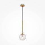 The Ligero Pendant Light - Brass With Clear Moire Glass boasts a modern design with an oval moiré glass shade, suspended by a black cord from a brass fixture and ceiling plate. Gold and clear glass elements elegantly contrast against the white background, enhancing any space.