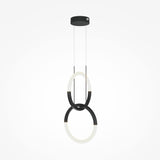 The Node LED 2 Rings Pendant Light - Black features two intertwined adjustable LED rings in black and white, suspended from a sleek black base. This modern fixture adds an elegant, minimalist touch to interiors, providing a striking contrast against a plain white background.