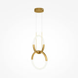 The Node LED 2 Rings Pendant Light - Gold showcases adjustable rings in a modern design. Two interlocking gold rings hang from a round ceiling base with thin cables, featuring integrated LED lights that cast a soft white glow.