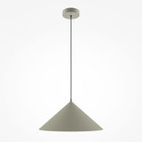 The Basic Colors Cone Pendant Light - Grey features a minimalist cone-shaped grey shade and a thin black cord, attached to a round ceiling mount. Its simple elegance against the plain white background makes it ideal for any modern interior.