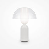 Introducing the Memory Table Lamp - White: a modern piece with a white cylindrical base, opal glass diffuser, and clear dome-shaped glass shade. Its sleek design emits soft ambient lighting, ideal for creating a calming atmosphere.