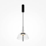 Introducing the Bangkok LED Pendant Light 25cm—a modern masterpiece with a black cylindrical fixture and a minimalist design. Its round clear glass shade elegantly houses the bulb, while a sleek black cord suspends it from the ceiling.