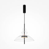 The Bangkok LED Pendant Light 40cm features a black rod with three stacked transparent glass shades of different sizes. The largest shade covers the light, providing a soft glow. Its sleek design includes a matte black ceiling mount and rod.