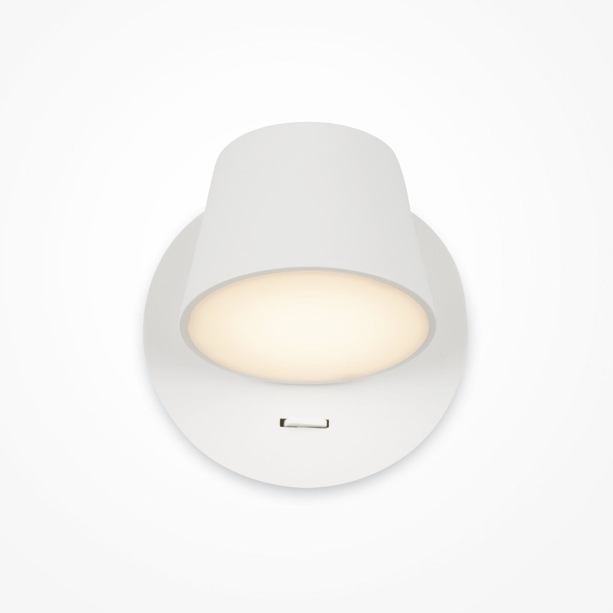 The Pixel LED Wall Light in white is a ceiling-mounted fixture with a simple modern design. It offers central task lighting with a soft glow, surrounded by a shadowed rim, and features a small rectangular notch for energy-efficient illumination.