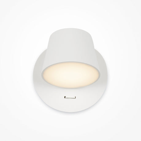 The Pixel LED Wall Light in white is a ceiling-mounted fixture with a simple modern design. It offers central task lighting with a soft glow, surrounded by a shadowed rim, and features a small rectangular notch for energy-efficient illumination.