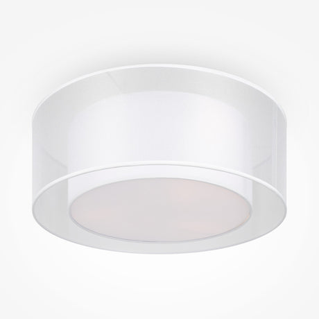 The Bergamo 3 Light Flush, featuring a white cylindrical design with a translucent shade, emits a soft, diffused glow. Its sleek simplicity suits minimalist interiors and modern settings perfectly.