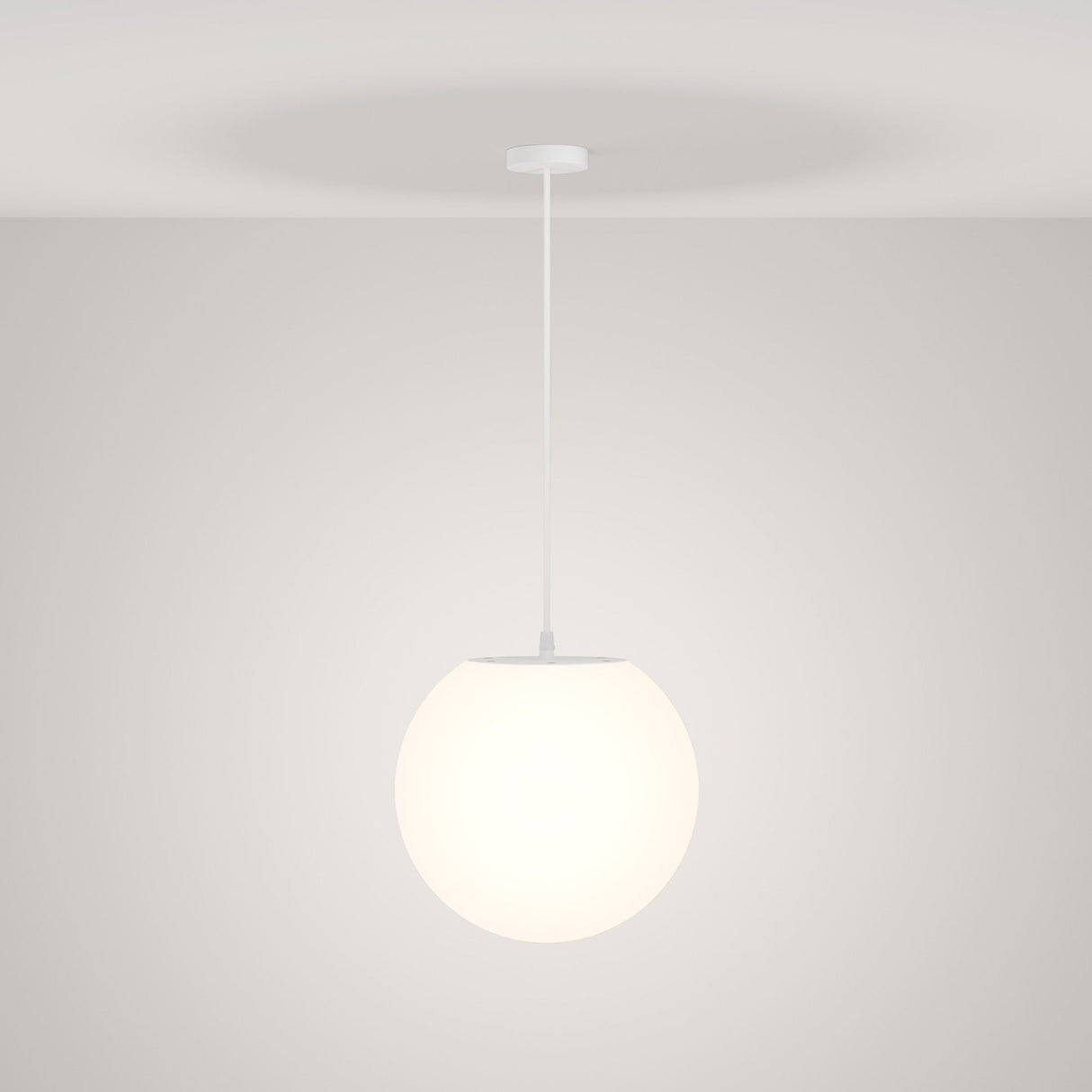 The Erda Outdoor Pendant Light - White features a modern, minimalist design with a glowing white spherical shade suspended by a thin white cord, offering a durable lighting solution.