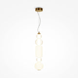 The Collar LED Pendant Light 35W - Gold features a graceful ceiling suspension with an elegant vertical design. It includes three stacked clear and frosted textured glass elements, all illuminated by an integrated LED strip.