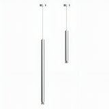 Two sleek Micro LED Pendant Lights - Silver with a contemporary cylindrical design hang from the ceiling on a plain white background; the left light is longer than the right.