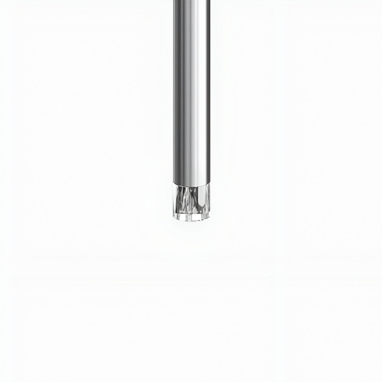 A close-up of the Micro LED Pendant Light - Silver shows its cylindrical metallic body with a silver finish and transparent tip, set against a plain white background�E€�Eideal for modern lighting.