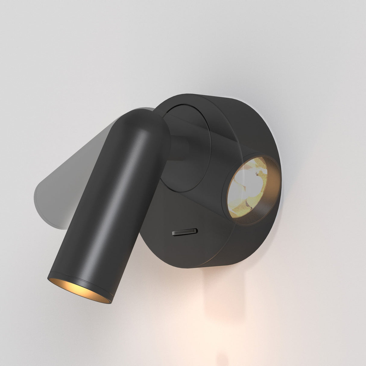 The Mirax LED Swivel Round Wall Light in black is a modern, wall-mounted spotlight with a cylindrical design. It directs light downward and swivels on a circular base, featuring an easy-to-use horizontal switch for adjustments.