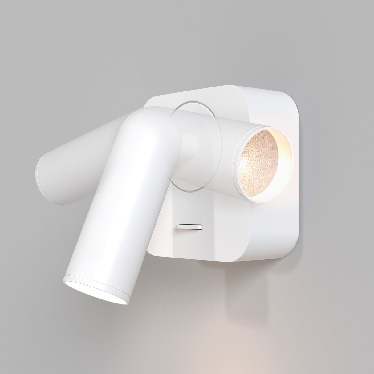 The Mirax LED Swivel Square Wall Light in white is mounted on a light gray wall. It has two cylindrical heads emitting soft white light, one directed downwards and the other angled to the side, utilizing energy-efficient LED technology.