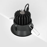 The partially installed Yin LED Dimmable Round Recessed Downlight 12W 4000K in white has metal spring clips for secure attachment, a visible power cord, and dimmable technology for adjustable brightness to suit any mood or setting.