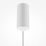 The Pro Shade LED Thin Pendant Light, with a sleek cylindrical design and smooth surface, hangs elegantly from the ceiling by a thin cord. Its minimalist look on a light gray background underscores its stylish and energy-efficient qualities.