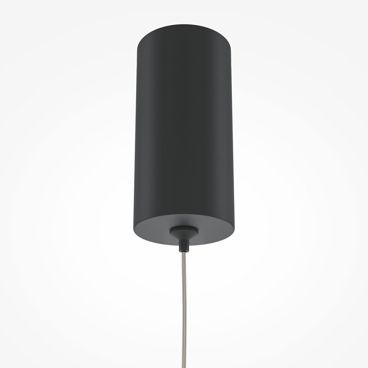 The Pro Base LED Thin Pendant Light - Black showcases a sleek cylindrical design with energy-efficient lighting, hanging by a single cable. Its dark gray hue complements the plain white background, highlighting its modern minimalist appeal.