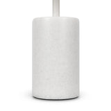 The white, polished cylindrical marble toilet brush holder, with a minimalist design and a slightly visible handle, mirrors the elegance of the Kyoto LED Table Lamp. Set against a plain white background, it complements an energy-efficient lifestyle.