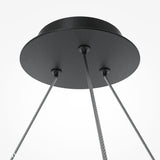 The Balance 6 Light Suspension features an industrial flair with three metal cables extending from a round black base, showcasing a sleek design against a white background, complemented by opal globes.