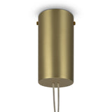 The Maya LED Glass Pendant Light - Gold features a cylindrical brushed gold finish with a textured transparent glass shade. Two wires extend from the bottom, and it’s flush-mounted on a white ceiling.