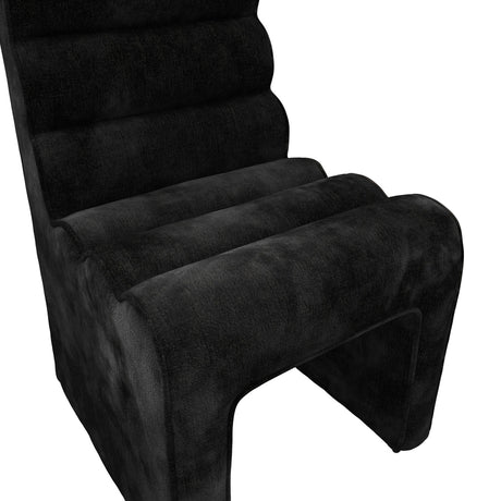 Nami Dining Chair in black velvet chenille, close-up of the ribbed contoured seat and backrest with panel-style legs, shown on a plain white background.
