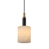 Niori Bellaro small pendant light with a ridged Spanish alabaster column shade, brushed brass vented cap and matt black stem, on a white background.