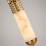 Close-up of the Zerith LED alabaster tube pendant light with fluted brushed brass collar and domed brass base cap, on a plain light grey background.