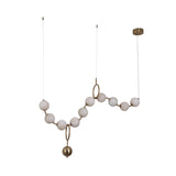 Niori Luxoria 10 light chandelier with alabaster globes threaded along a polished brass-toned armature with ring details, twin ceiling canopies.