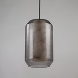 Niori Vale faceted pendant light with a natural Spanish alabaster core inside a smoked glass lantern shade on a black flex, shown on a light background.