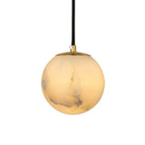 Lyvane small globe pendant light with a spherical natural alabaster shade, brushed brass cap, and black flex cord, shown on a plain white background.
