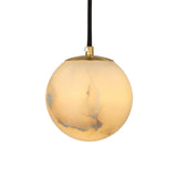 Lyvane 1 Light globe pendant with a natural alabaster shade in soft white, brushed brass collar, and black flex cord, shown against a plain white background.