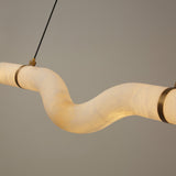 Niori Zareon LED Small curved alabaster chandelier with S-shaped soft white stone section and brushed brass cradles, suspended on a slim cable.