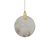 Niori Luna 200mm alabaster disc pendant light with brushed brass hinge and suspension cable, shown against a plain white background.