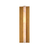 Elvaris Medium vertical wall light with a glowing alabaster centre panel framed by brushed brass fins, shown lit against a plain white background.
