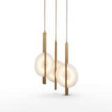 Niori Elyra 3 light cluster chandelier with staggered flat oval alabaster discs on brushed brass blade stems, shown against a white background.