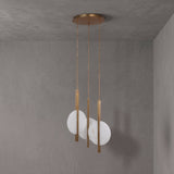 Niori Elyra 3 Light LED Alabaster Cluster Chandelier in brushed brass with staggered flat oval alabaster discs on blade stems, mounted to a grey ceiling.
