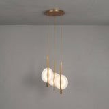 Niori Elyra 3 Light LED Alabaster Cluster Chandelier in brushed brass with three staggered alabaster discs on slender blade stems and a round canopy.