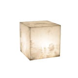 Blocchetto LED Cube Alabaster Table Lamp, 12cm solid stone cube with softly glowing interior light, natural mottled finish, plain white background.