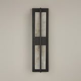 Niori Caldera LED Alabaster Wall Light Small in matt black, featuring two vertical alabaster panels split by a central bar, mounted on a pale wall.