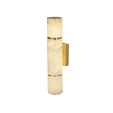 Niori Almora medium alabaster cylinder wall light with brass banding and rectangular brass wall plate, shown against a plain white background.