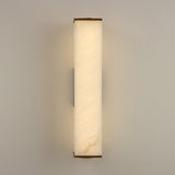 Valmere LED Small Linear Alabaster Wall Light in soft white, a rectangular alabaster panel with brass end caps glowing warm white, shown on a plain light wall.