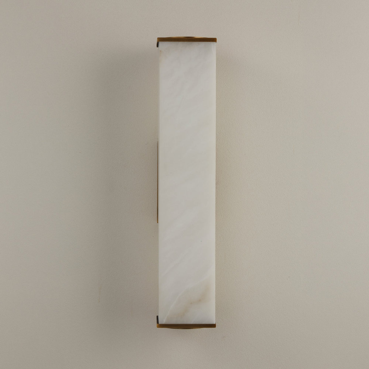 Valmere LED Small Linear Alabaster Wall Light in Soft White, a slim rectangular alabaster panel with brass end caps and frame, shown against a plain light background.
