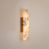 Selvara LED Small Alabaster Double Wall Light in brushed brass, featuring two offset vertical alabaster panels glowing warm white on a plain light background.