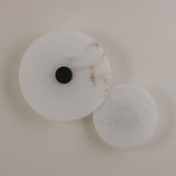 Solmira LED Dual Disc Alabaster Wall Light with overlapping large and small stone discs and a brushed brass centre detail, shown on a plain light background.