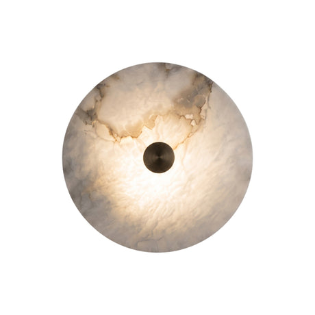 Cerchio LED Round Alabaster Wall Light 25cm in Brass, a circular natural alabaster disc with a central brass boss, glowing warmly against a plain white background.