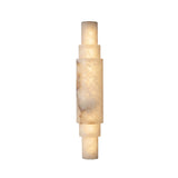 Niori Aurelia LED wall light with stacked cylindrical natural alabaster sections and brushed brass end caps, shown on a plain white background.